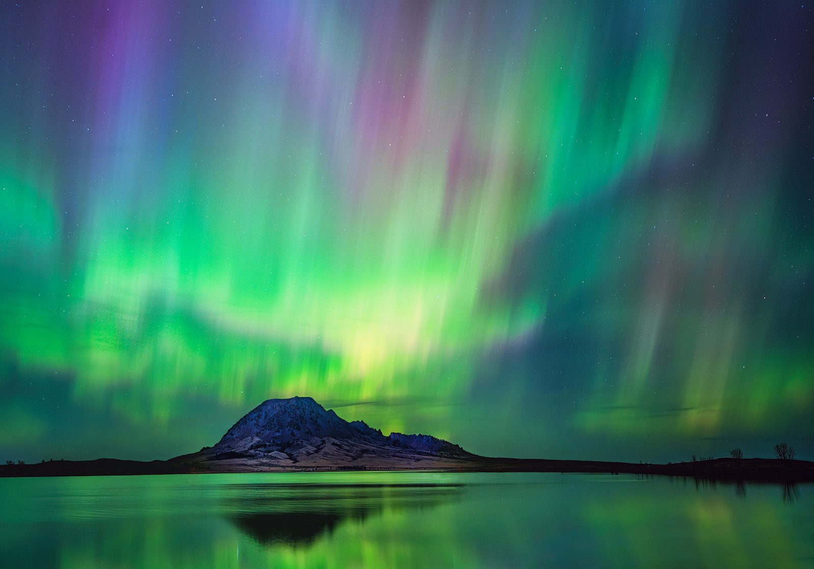 Website Bear Butte Floating In Northern Lights